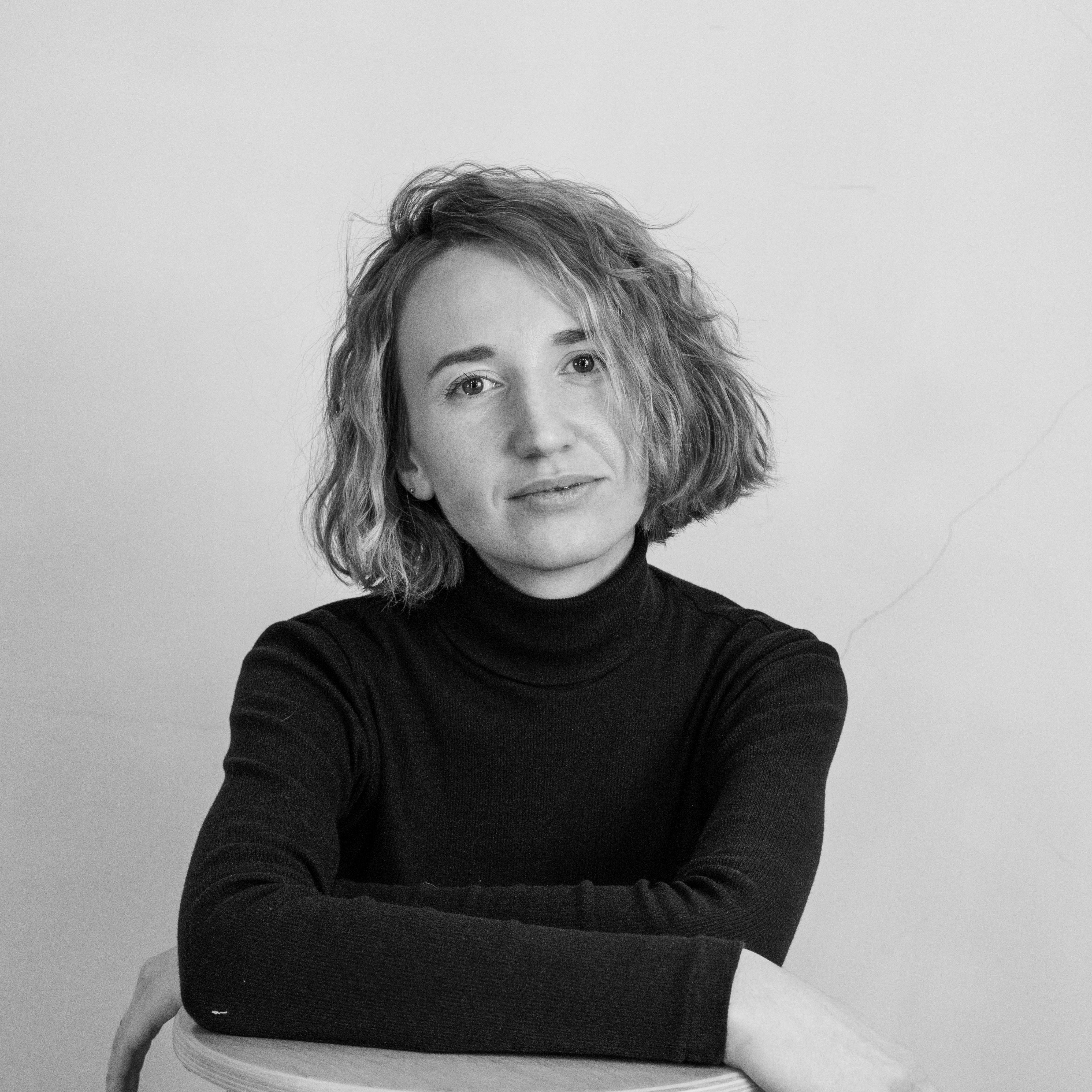 A Woman in Black Turtleneck Sweater