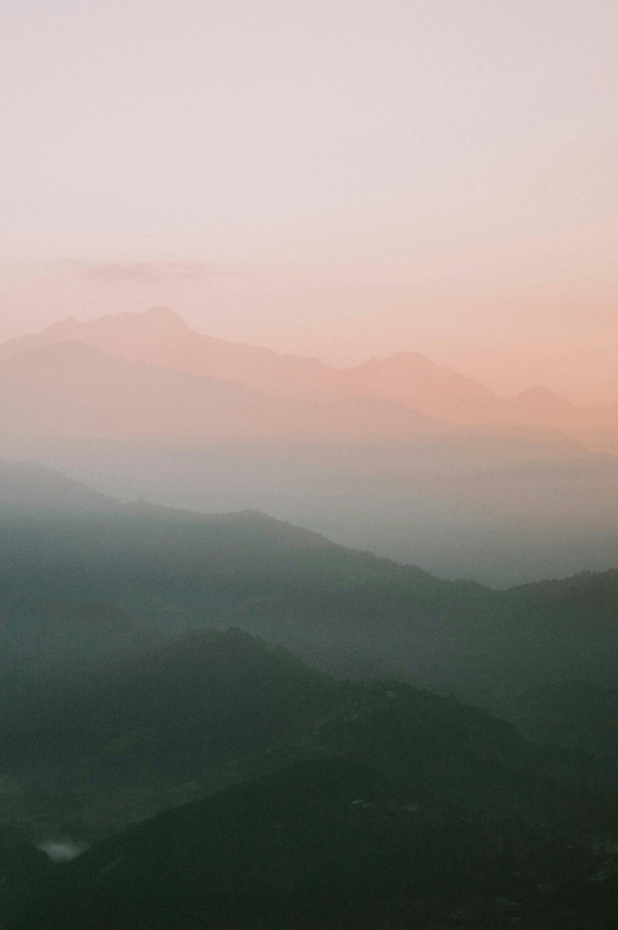 Stunning sunset over the Himalayan hills in Nepal, showcasing a dramatic sky and natural beauty.