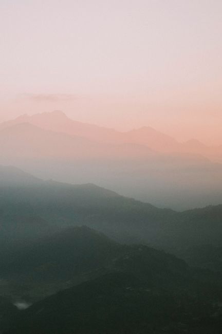 Stunning sunset over the Himalayan hills in Nepal, showcasing a dramatic sky and natural beauty.