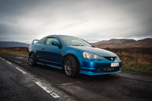 Blue Audi Coupe on Road