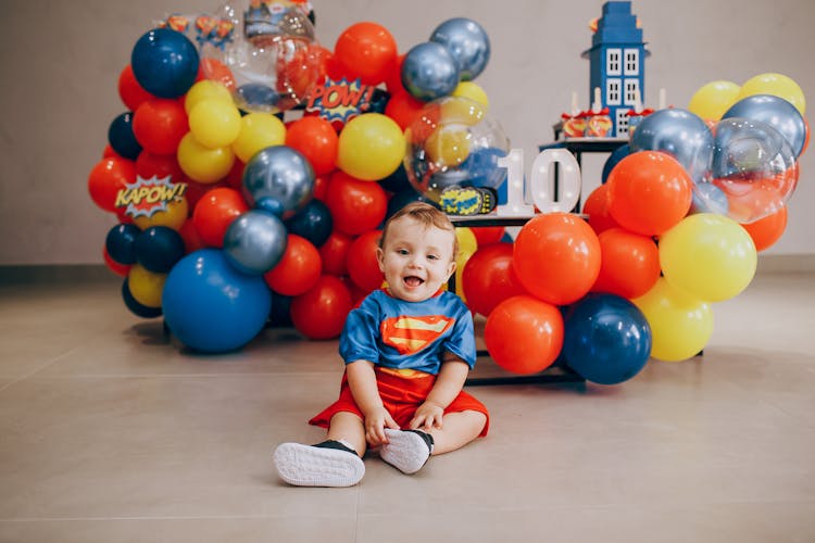 A Young Boy In His Superman Costume