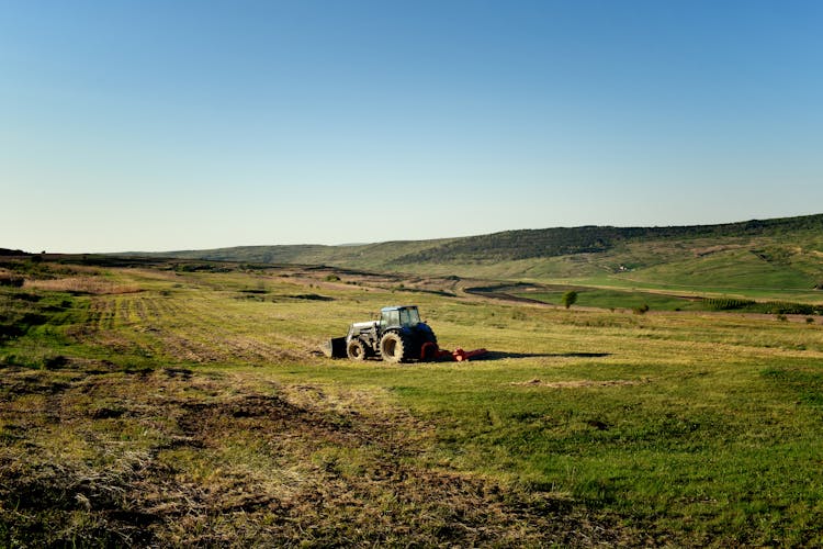 Photo Of Tractor On Fields