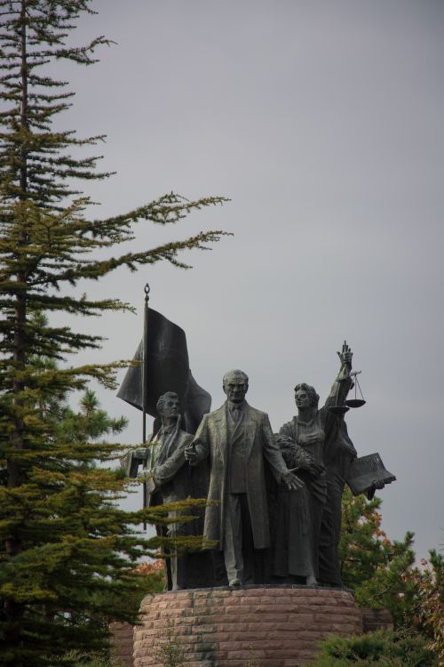 Free Statue monument surrounded by trees in Ankara, Turkey, symbolizing unity and justice. Stock Photo