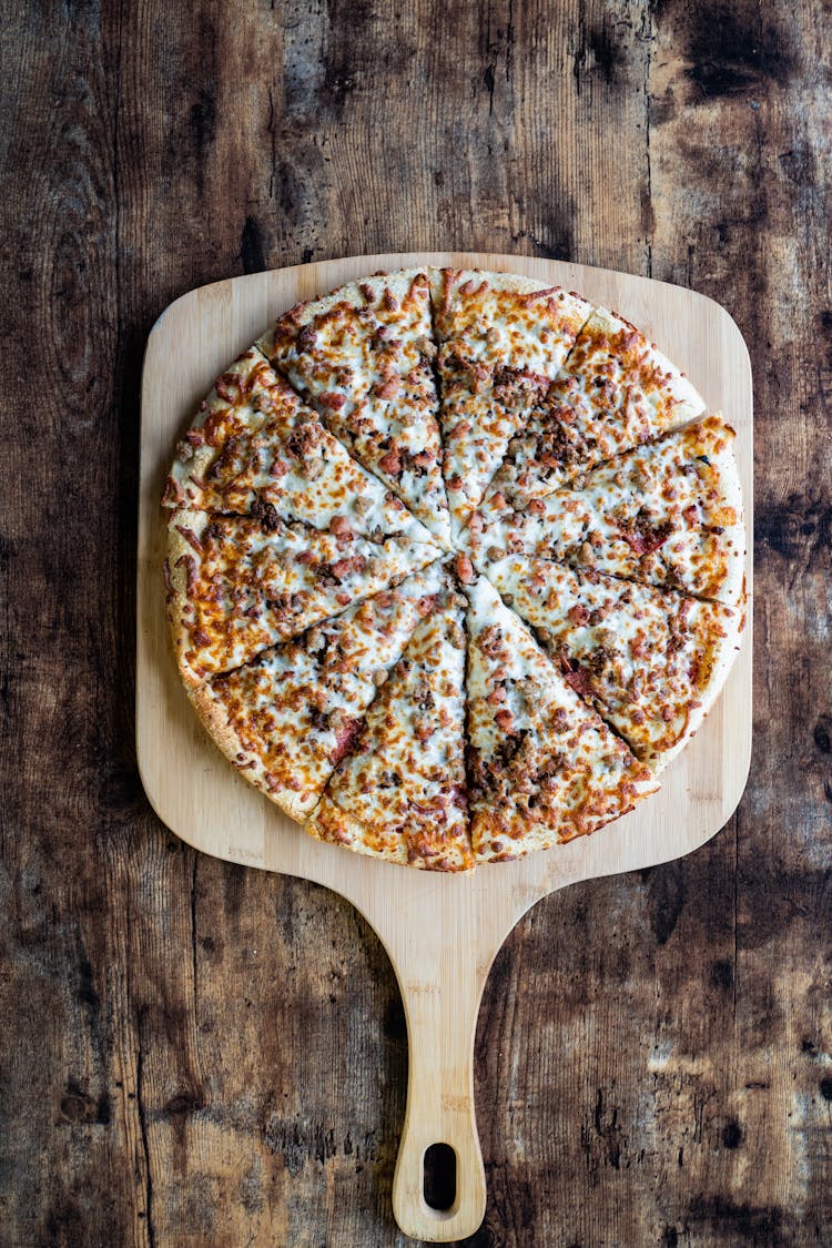 Pizza On Brown Wooden Board