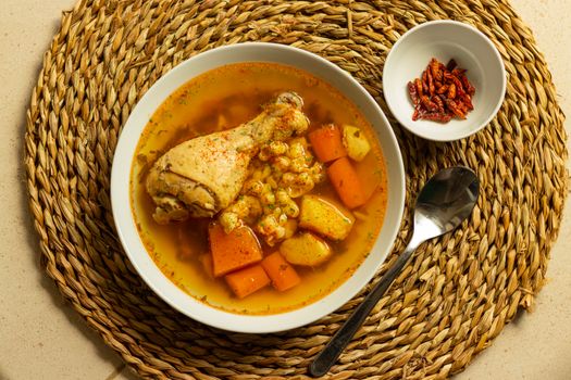A savory chicken stew with vegetables, showcasing vibrant colors and rich flavors, perfect for a hearty meal.
