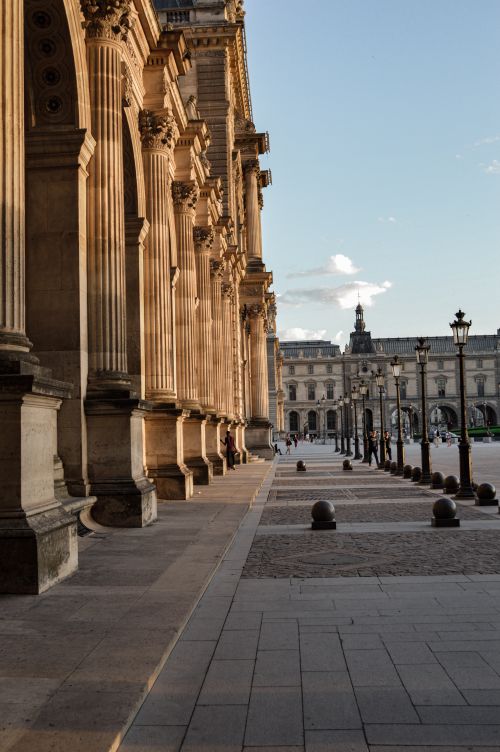 Free Sunlit view of the historic Louvre Museum and its architecture in Paris, France. Stock Photo