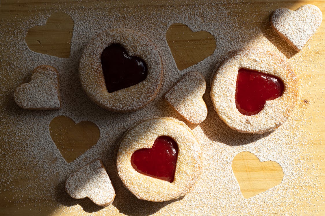 Pastry Products with Heart Shape Holes Filled with Jam
