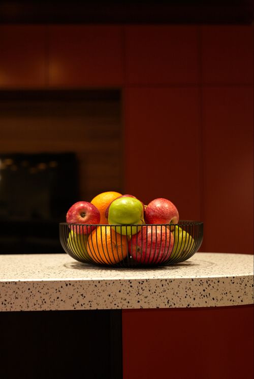 Free A colorful mix of fruits in a metal bowl on a speckled countertop indoors. Stock Photo