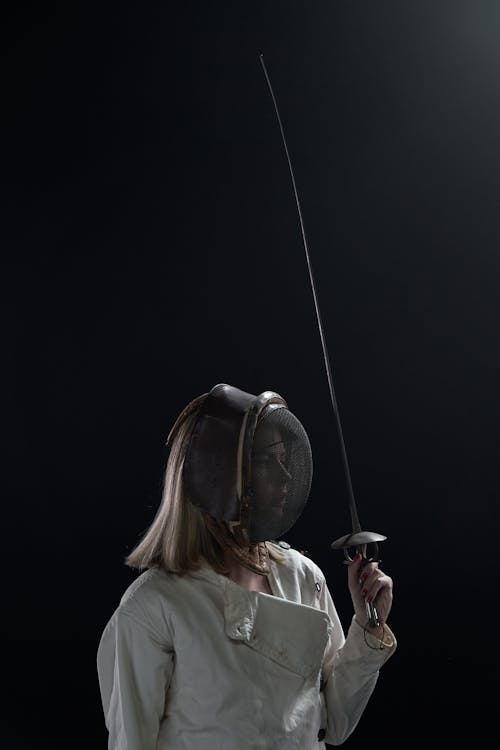 A Woman Holding a Fencing Sword