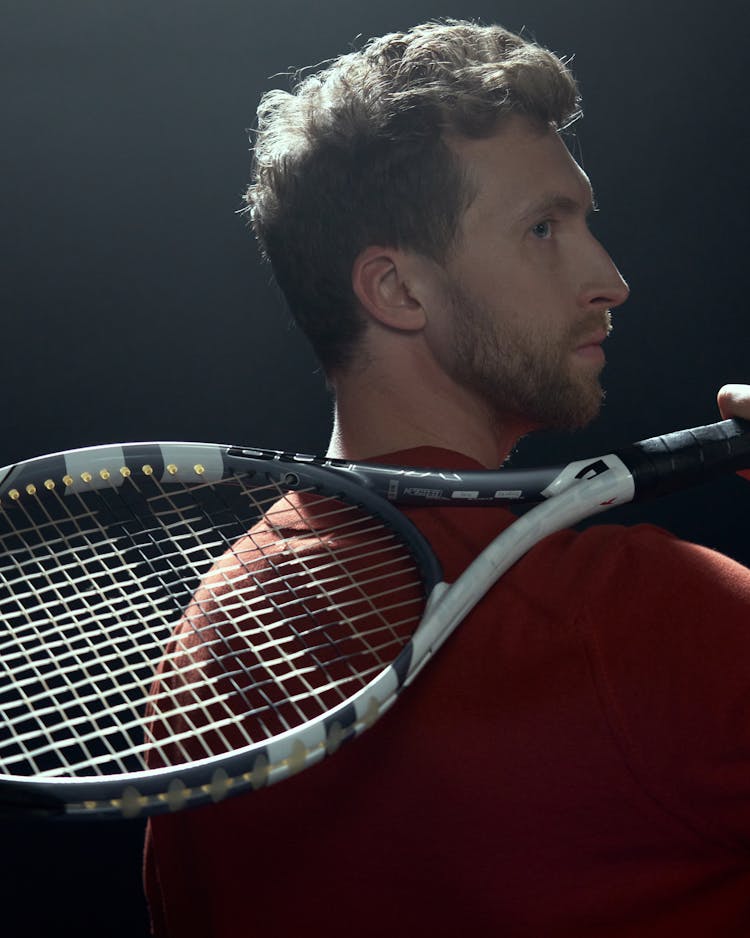 Man Holding A Tennis Racket