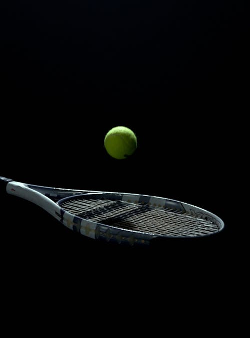 A Tennis Ball Bouncing Off a Tennis Racket