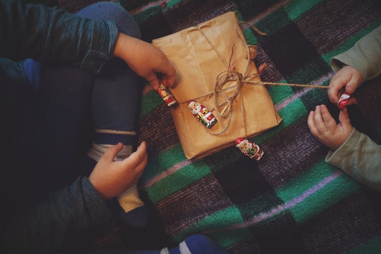 Child Unwrapping A Present