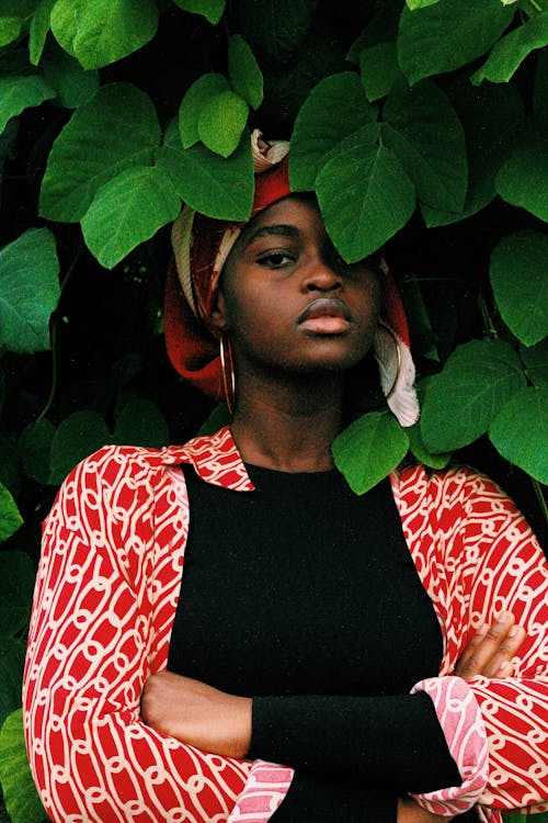 Woman Standing in Front of Vines