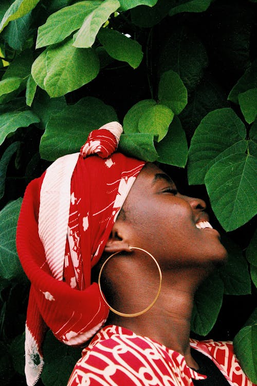 Profile view of Smiling Woman and Leaves