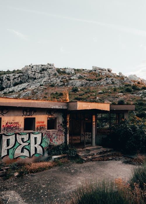 Free Vandalized Wall of an Abandoned Building Stock Photo