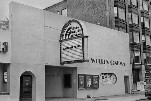 Black and white photo of Orson Welles Cinema facade, Cambridge, MA. Historical architecture.