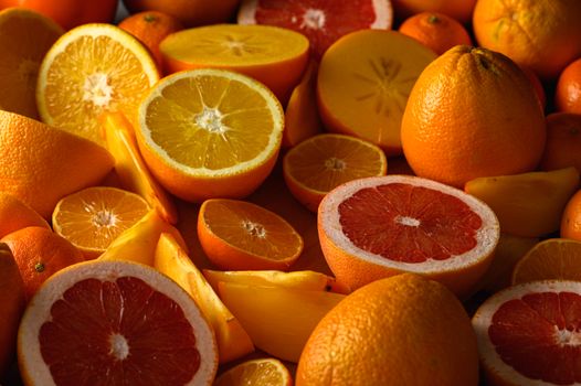 A colorful assortment of sliced citrus fruits, including grapefruits and oranges, showcasing their freshness and vibrancy.