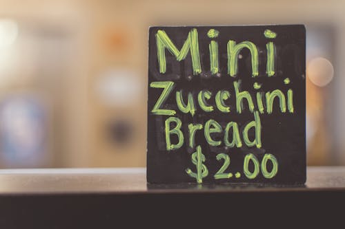 Close-up Photography of Mini Zucchini Bread Sign