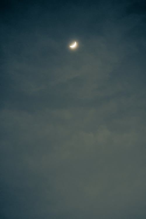Crescent Moon Over a Cloudy Sky