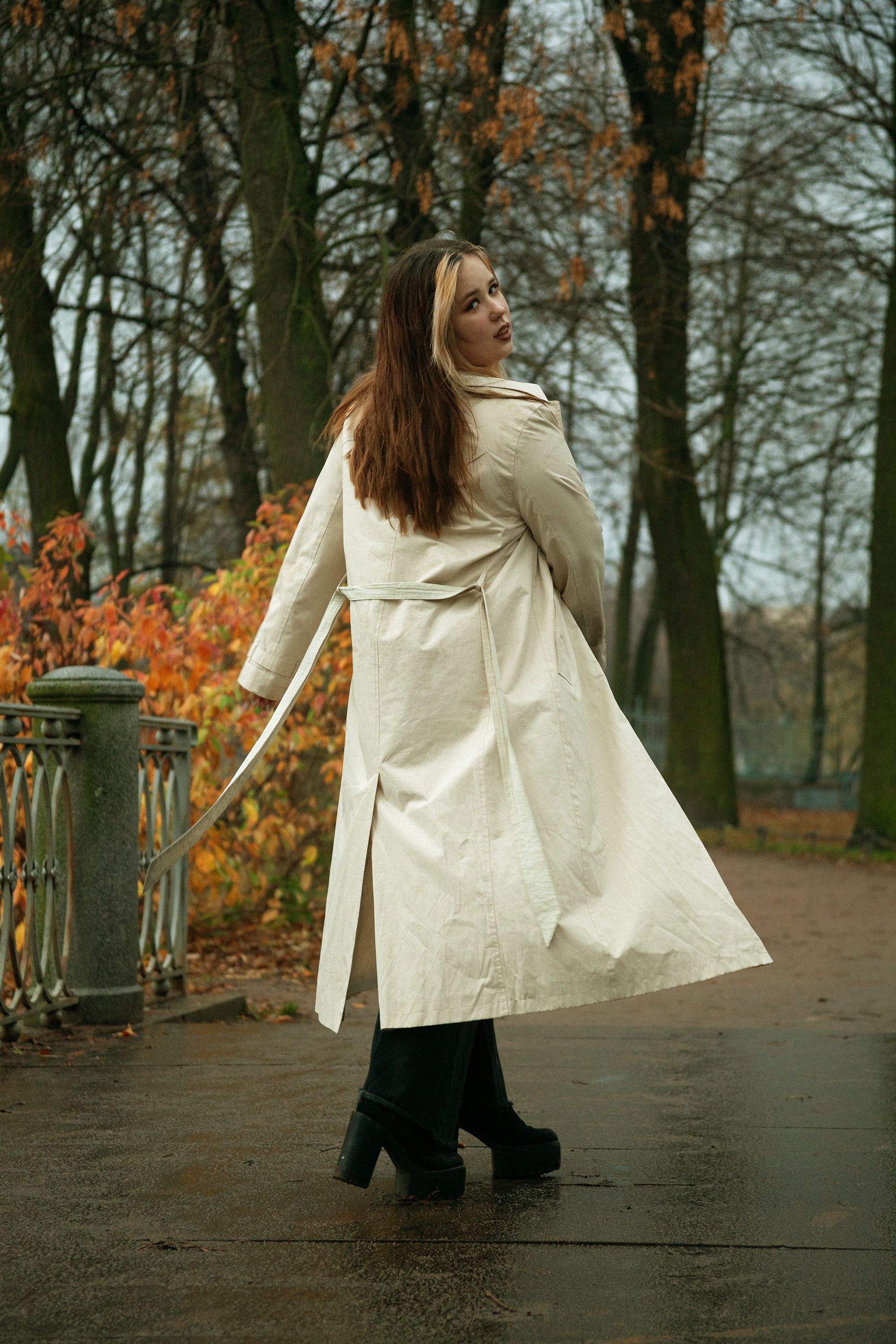A Woman in Trench Coat Walking in the Park · Free Stock Photo