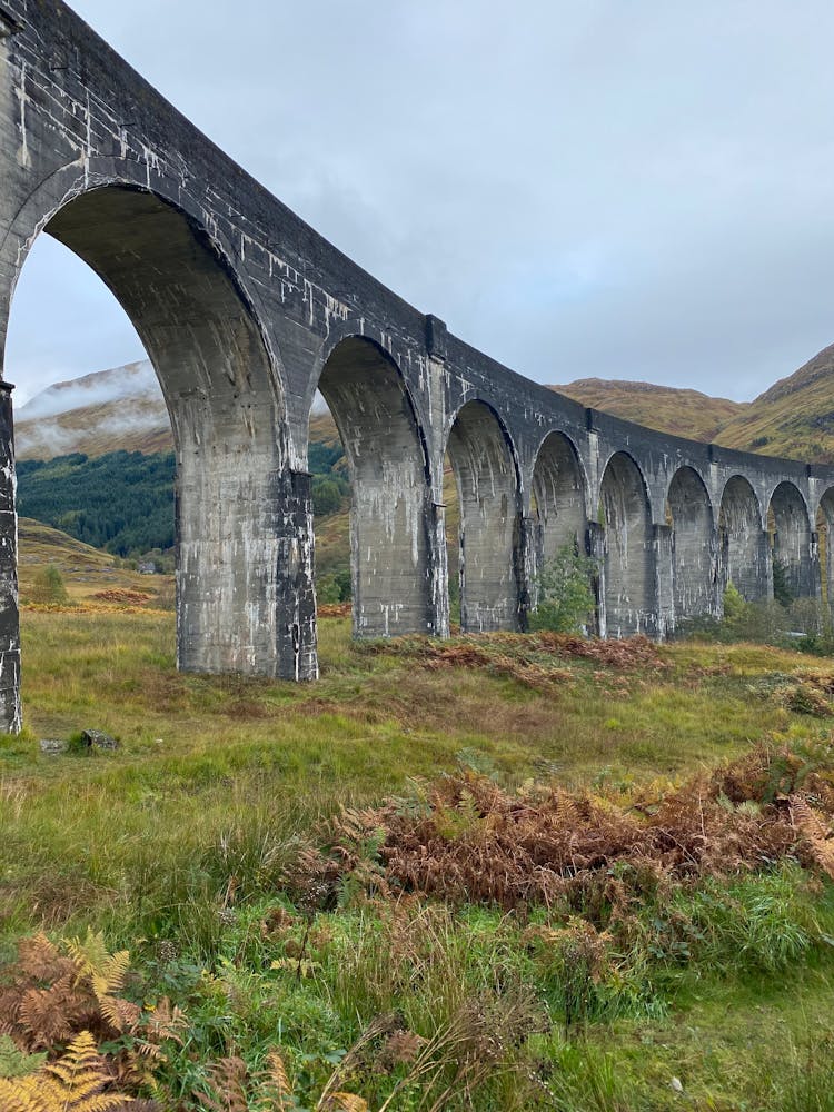 Glenfinnan Viaduct Over Green Grass Field