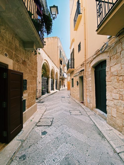 Free Explore the picturesque cobblestone alleyways of Bari's historic center. Stock Photo