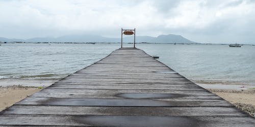 Free stock photo of cloudy sky, jetty, mountains