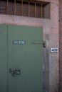 Green Door With White and Black Number 10