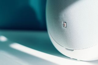 Fabric-wrapped speaker on a sunlit ledge — photo by Tom Swinnen on Pexels