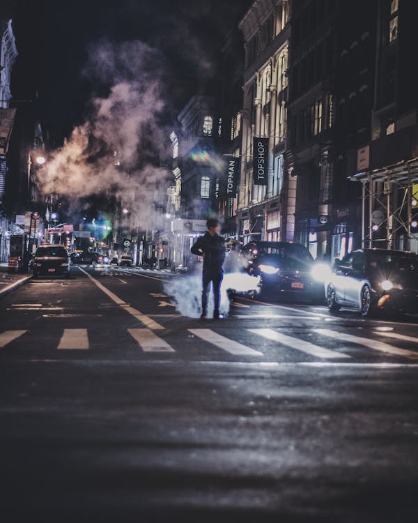 Photo of Man in the Middle of the Road