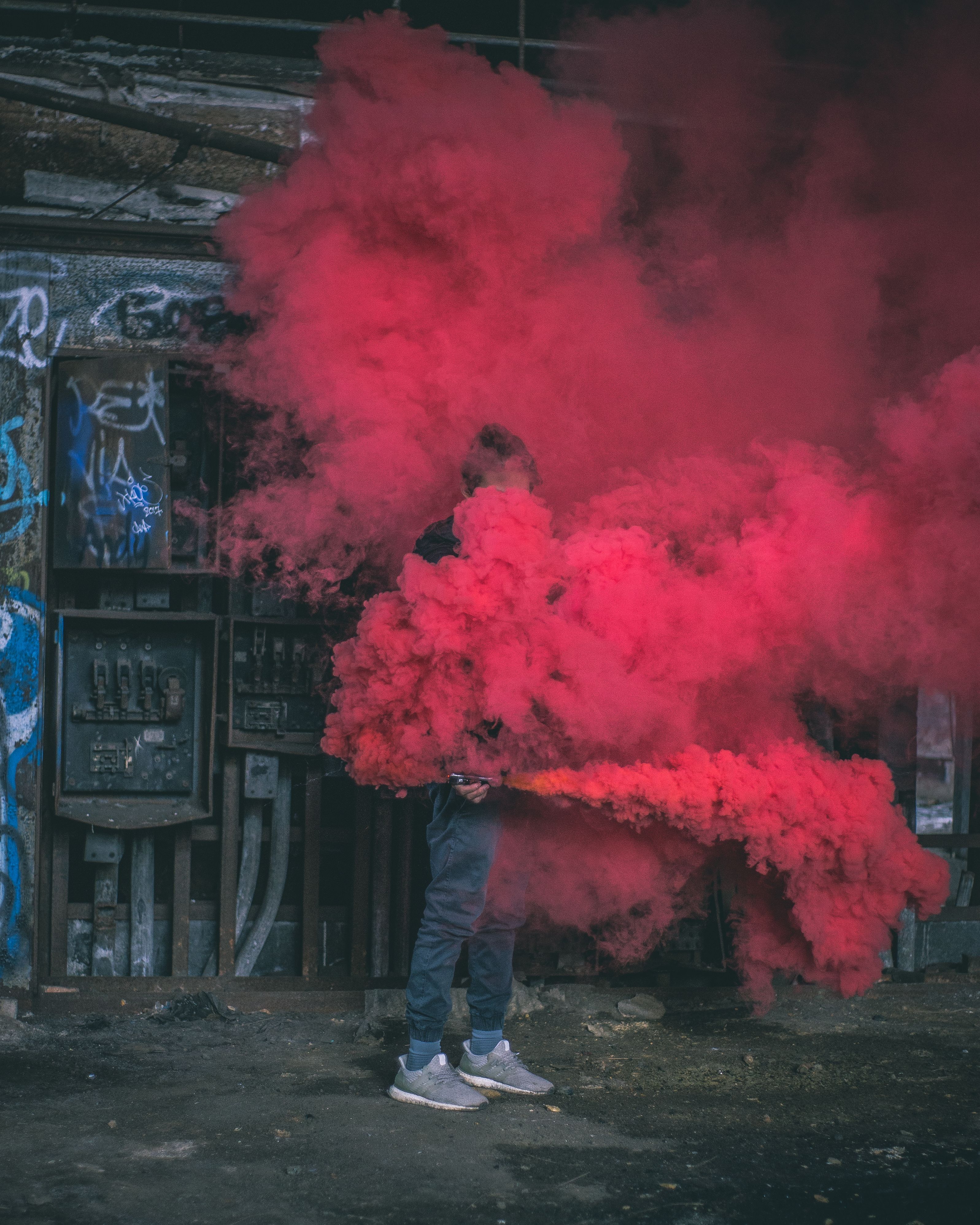 Photo Of Man Surrounded By Red Smoke Free Stock Photo