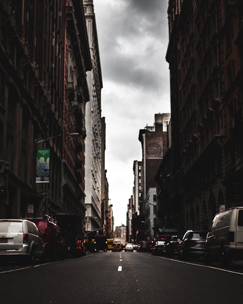 Photography of Roadway In the Middle of Buildings