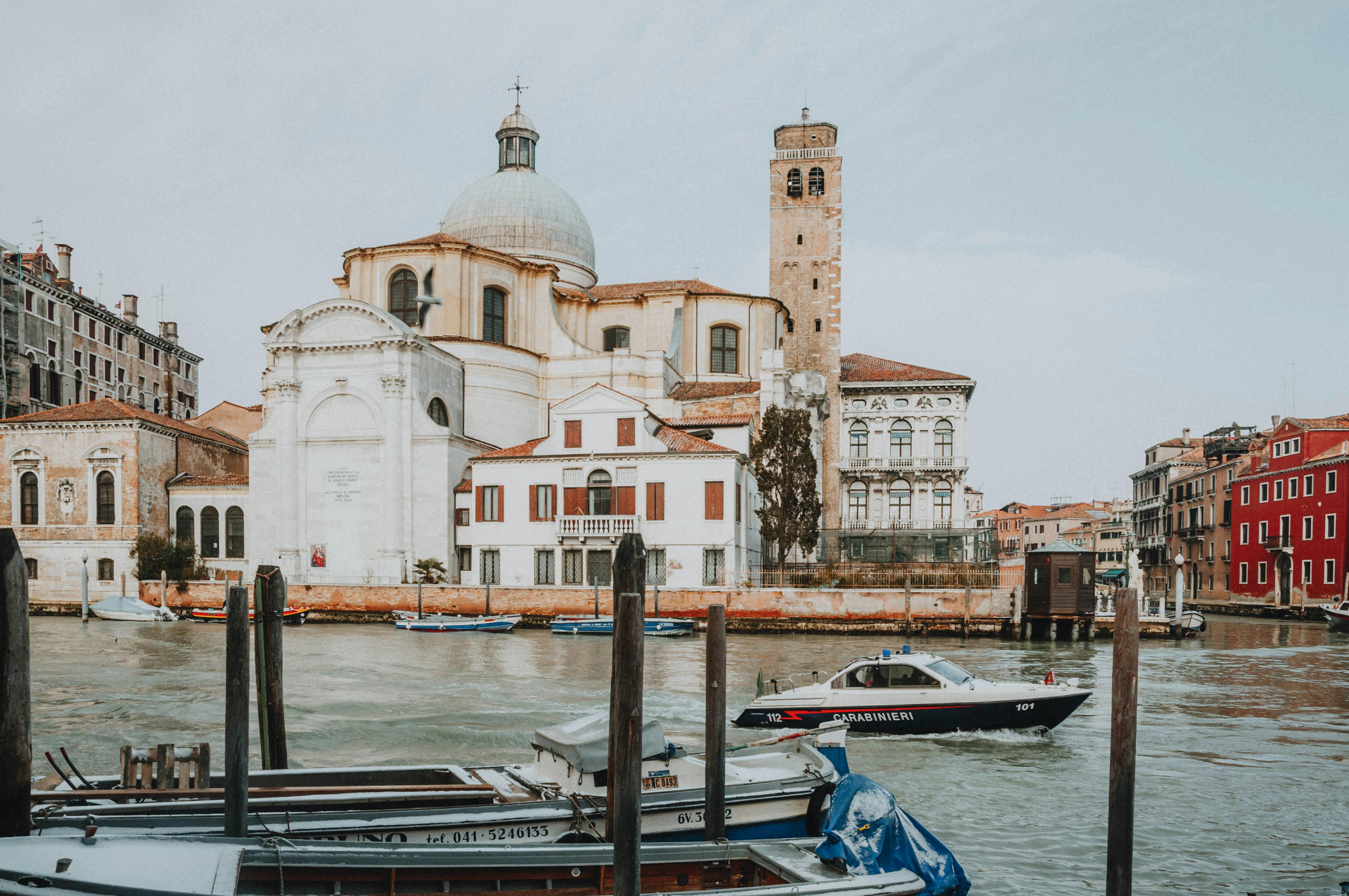 Free Scenic view of the Grand Canal with Church of San Geremia and watercrafts in Venice, Italy. Stock Photo