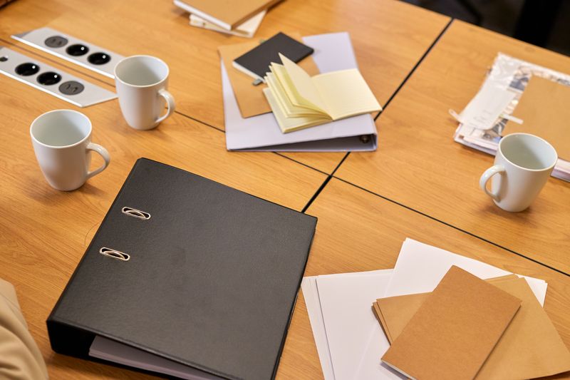 office desks each with a small inbox tray