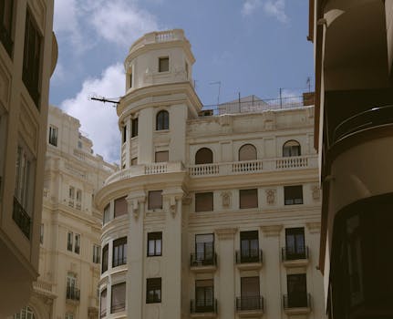 Stunning view of classic Valencian architecture with ornate details under a bright summer sky.