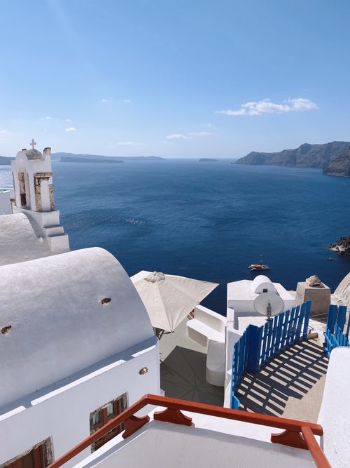 Free Stunning view from Santorini, Greece showcasing white facades and blue sea under clear skies. Stock Photo