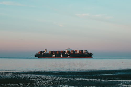 Cargo Ship Cruising on Sea