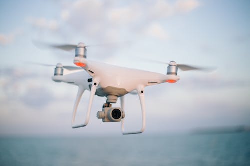 Free Quadcopter Flying on the Skey Stock Photo