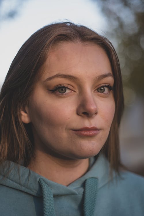 Close Photo of a Woman in Hoodie Sweater