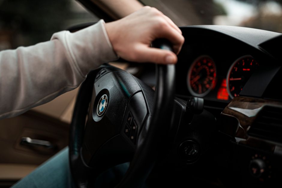 Radar detector mounted on car dashboard on a busy highway