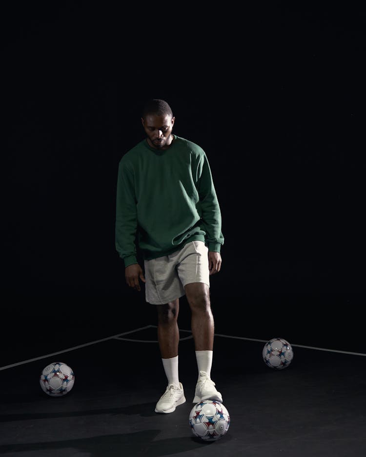 A Man Stepping On The Football