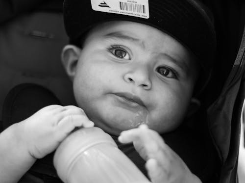 Free Grayscale Photo of Baby Wearing Black Cap Stock Photo