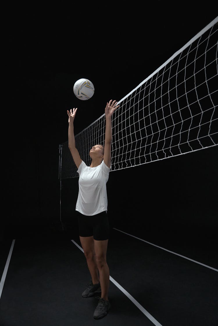 A Woman Playing With Volleyball