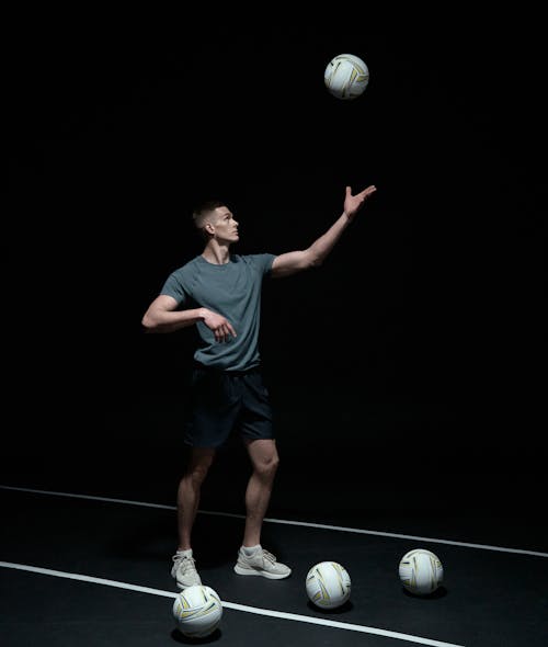 Photo of a Man Playing Volleyball