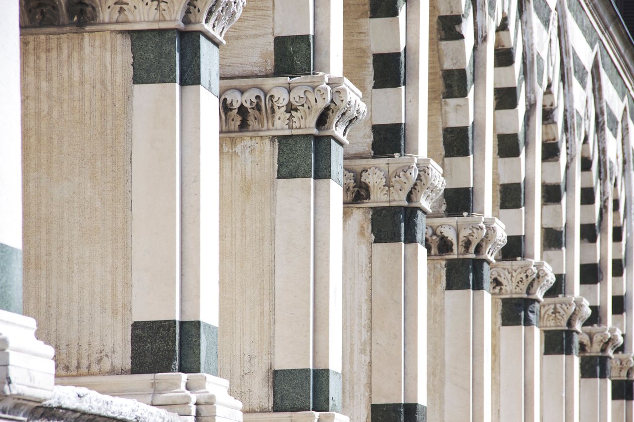 close up of marble columns in florence showcasing ornate carvings and