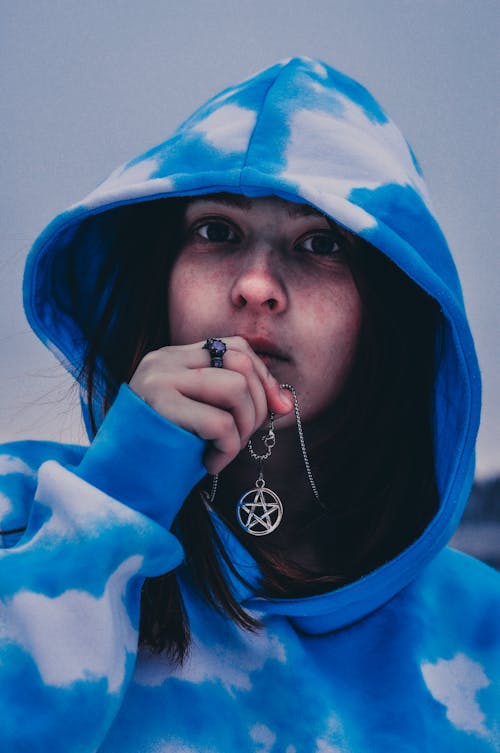 Close-Up Shot of a Woman in Blue Hoodie