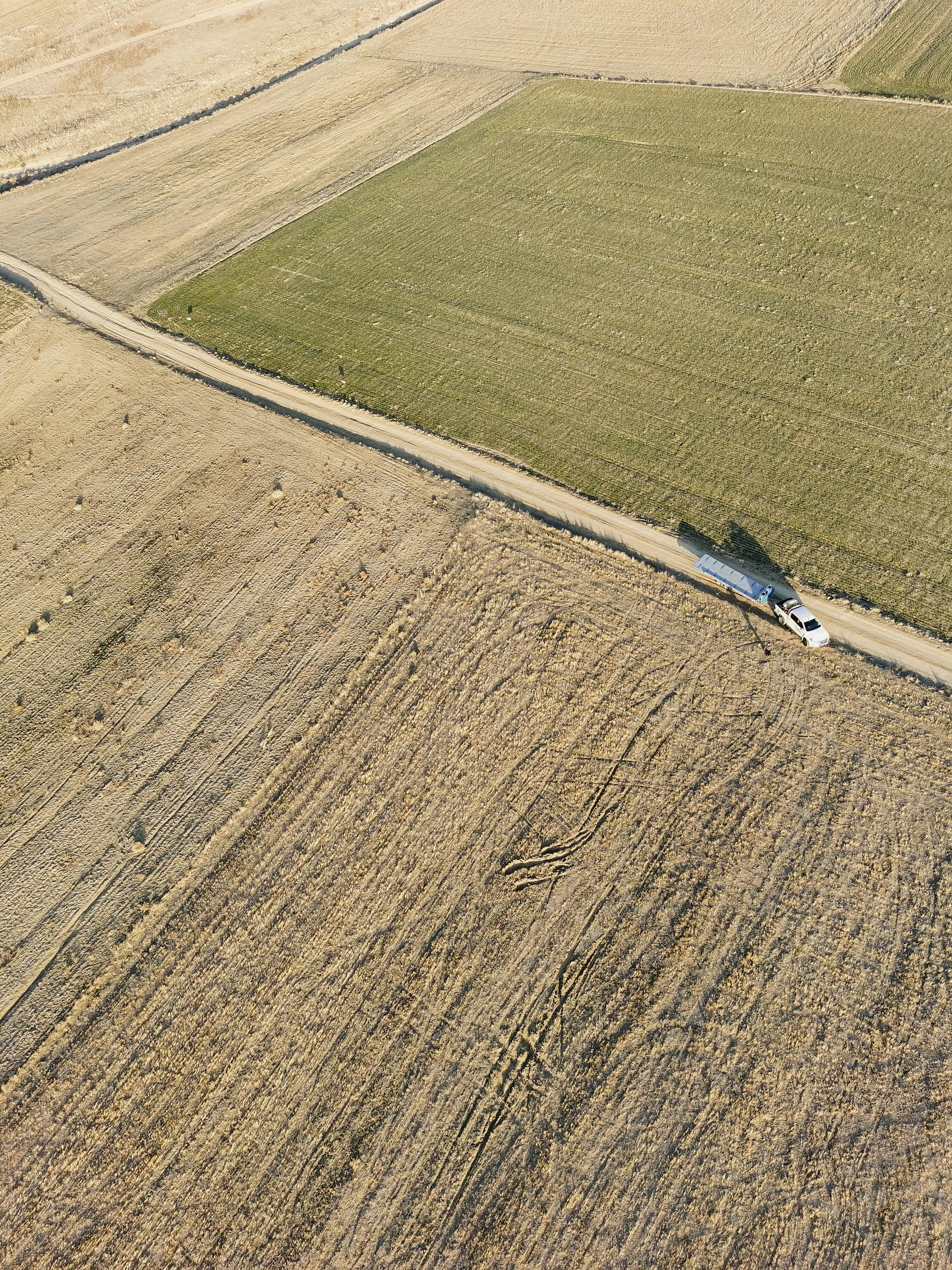 Aerial shot of farmland in Turkey showing expansive fields and rural roads.