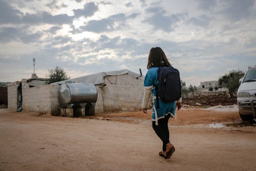 Girl Carrying a Backpack