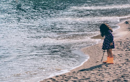 Little Girl Standing on Shore