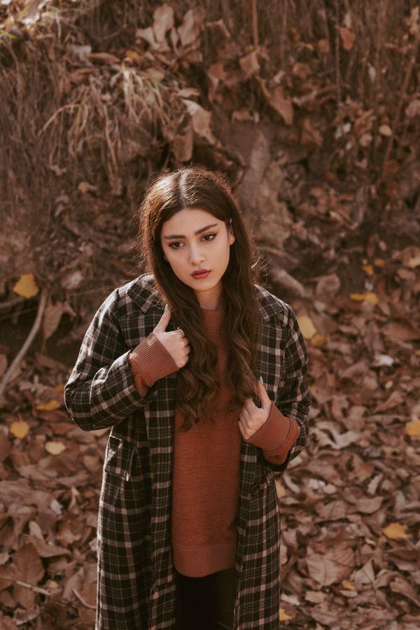 Woman in plaid wool coat and black dress